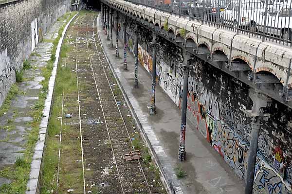 Paris rail line with graffiti  ...