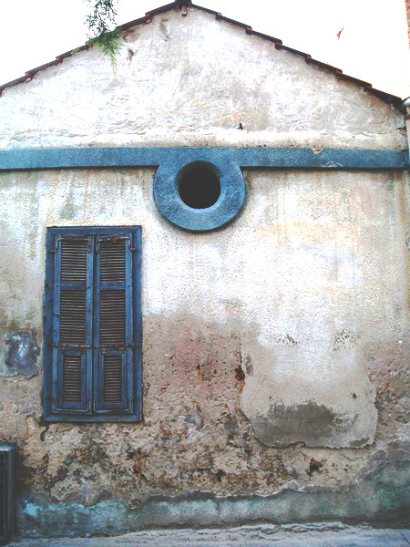 Lovers behind closed shutters at siesta time -