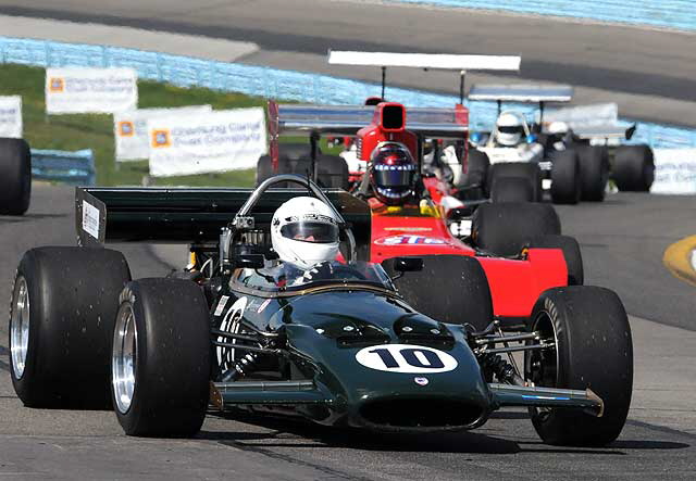 Bruce Lesson's 1969 McLaren M10B leading the pack through the esses